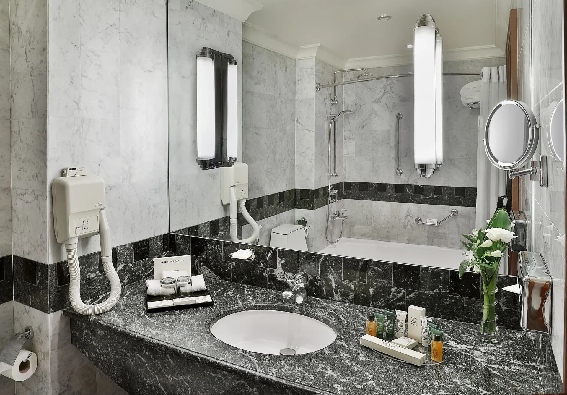 slippers, towels, hair dryer, Combined shower/bathtub at Madinah Hilton Hotel