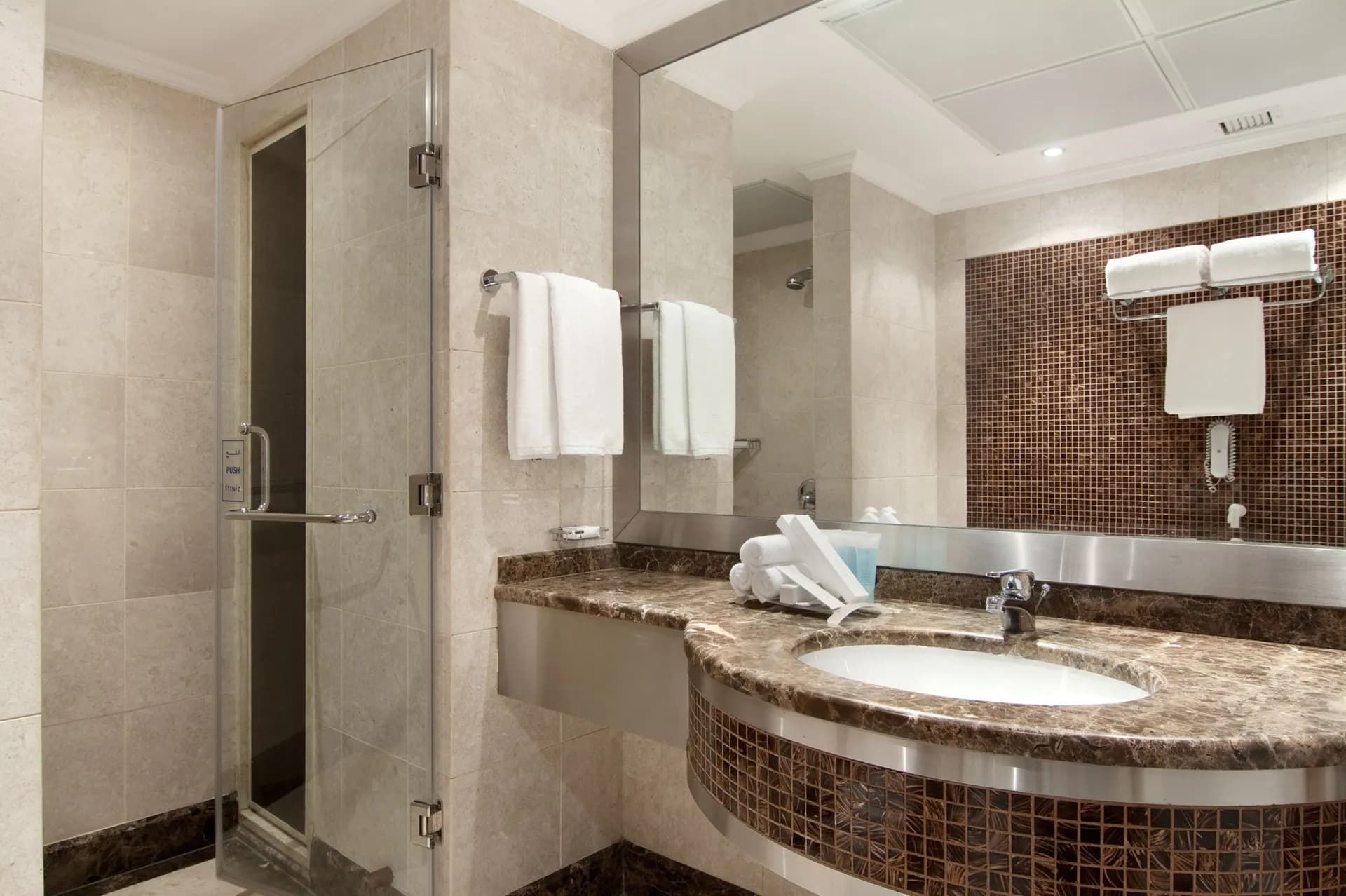 Combined shower/bathtub, free toiletries, slippers, hair dryer at Makkah Towers