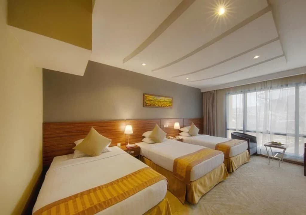 Standard Triple Room Side Haram View at Al Safwah Royale Orchid Hotel Makkah